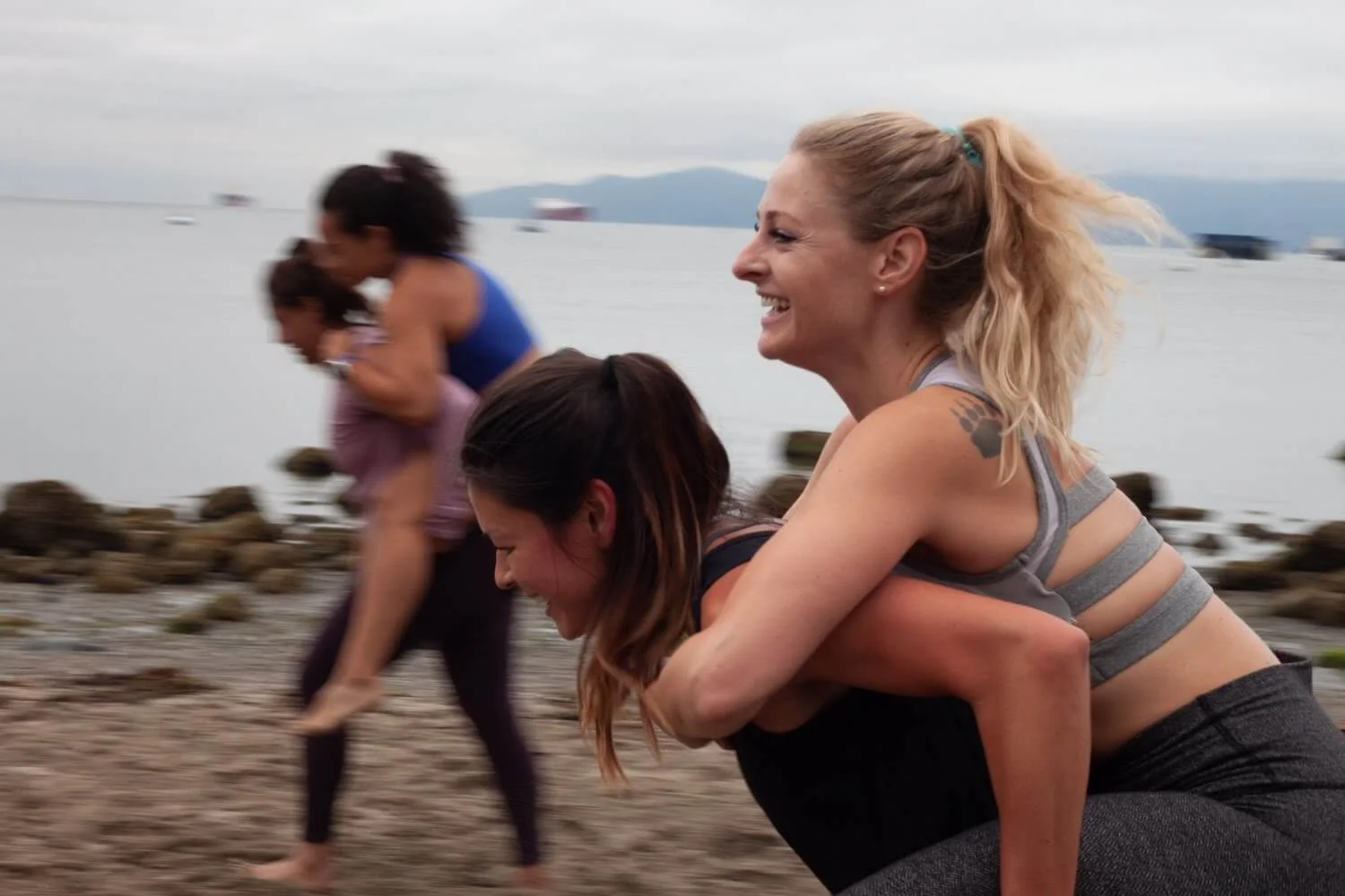 Kim doing a group workout at Kits Beach in Vancouver