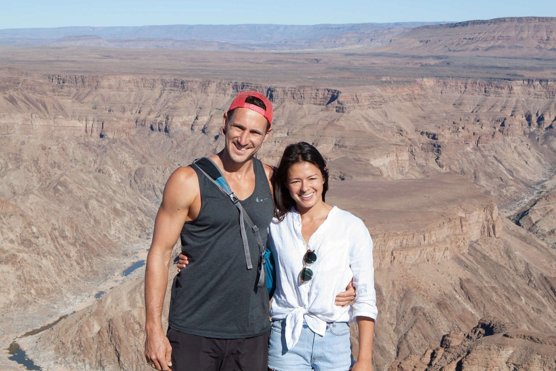 Chris and Kim with views of Fish River Canyon in Namibia, in the background.