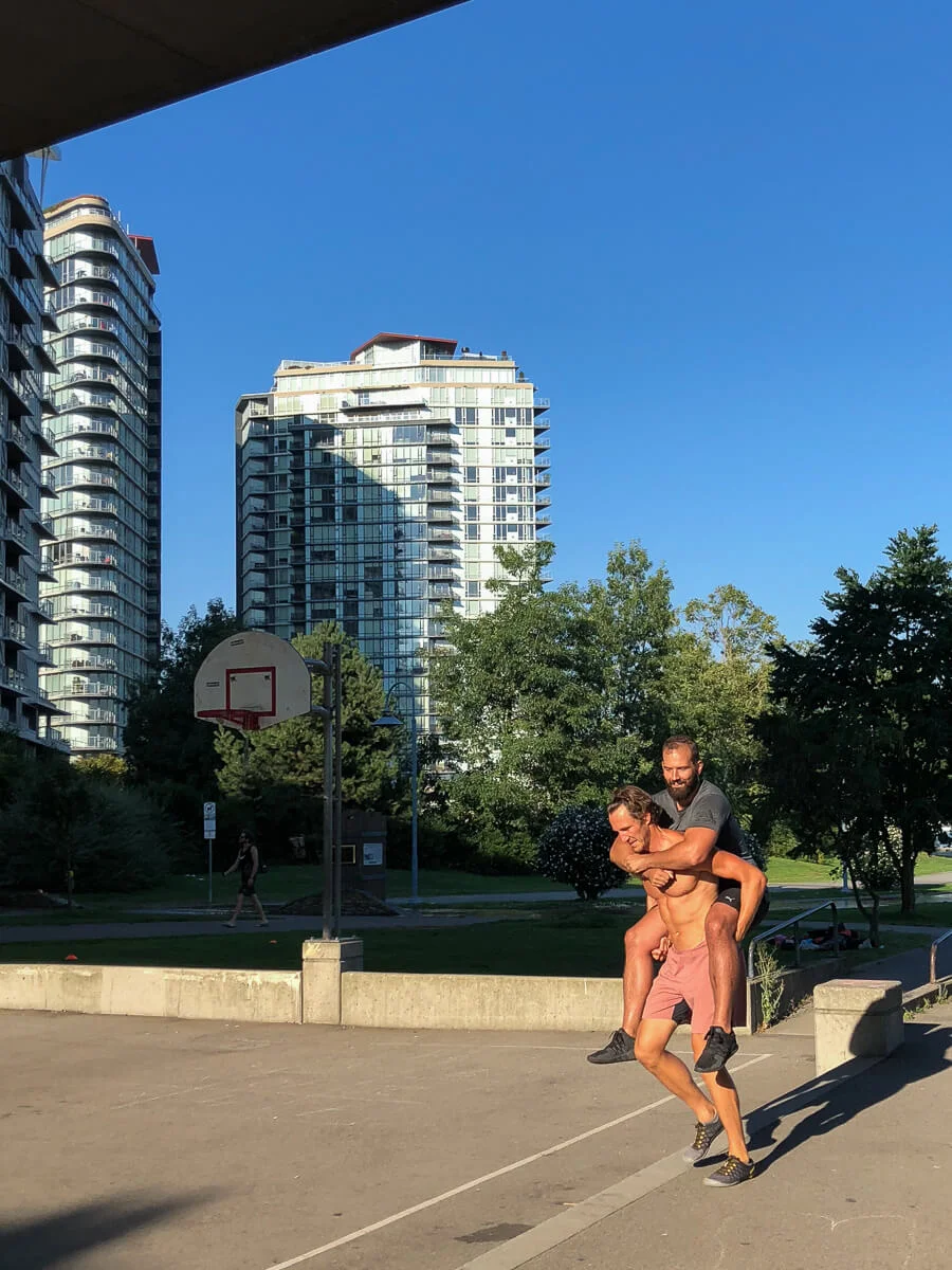 Piggy back working out outdoors in Vancouver