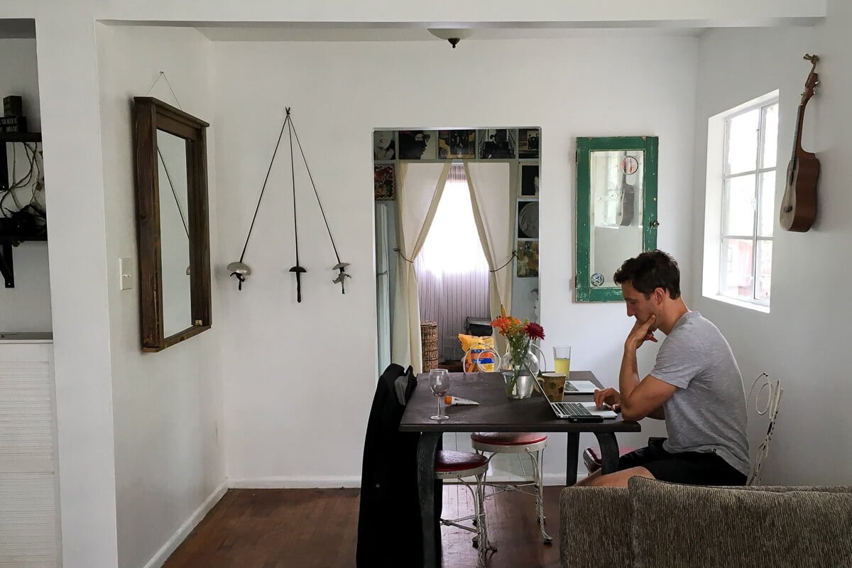 Chris working at a table in Airbnb