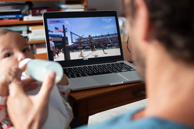 Watching YouTube volleyball instead of listening to podcasts while feeding Zac
