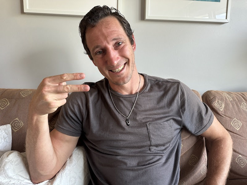 Chris showing off the flip flop pendant of his info-ligion.