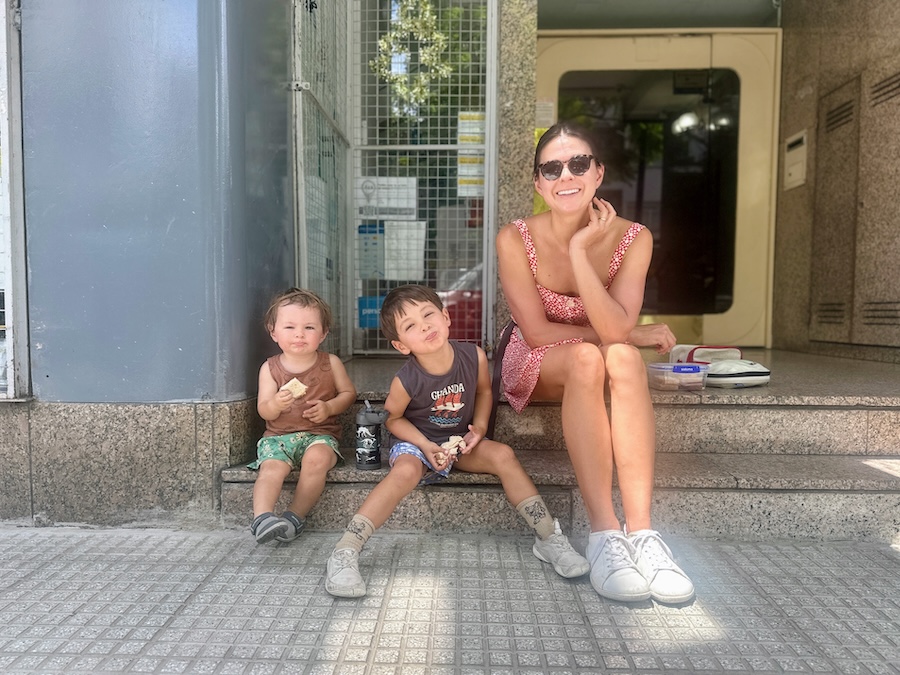 Kim and boys on stoop in Buenos Aires