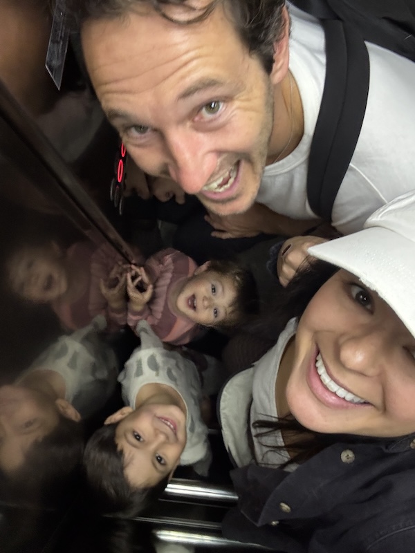Chris and family crammed in elevator